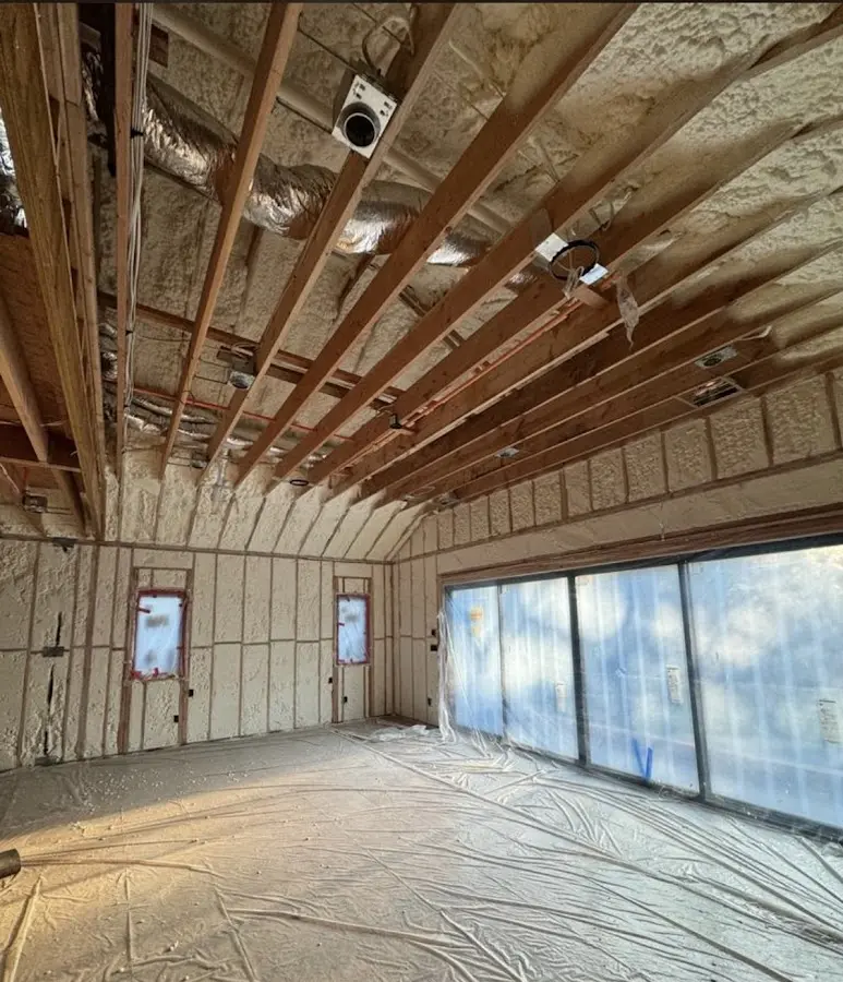 Interior walls and ceiling insulated with spray foam during new construction in North Arlington